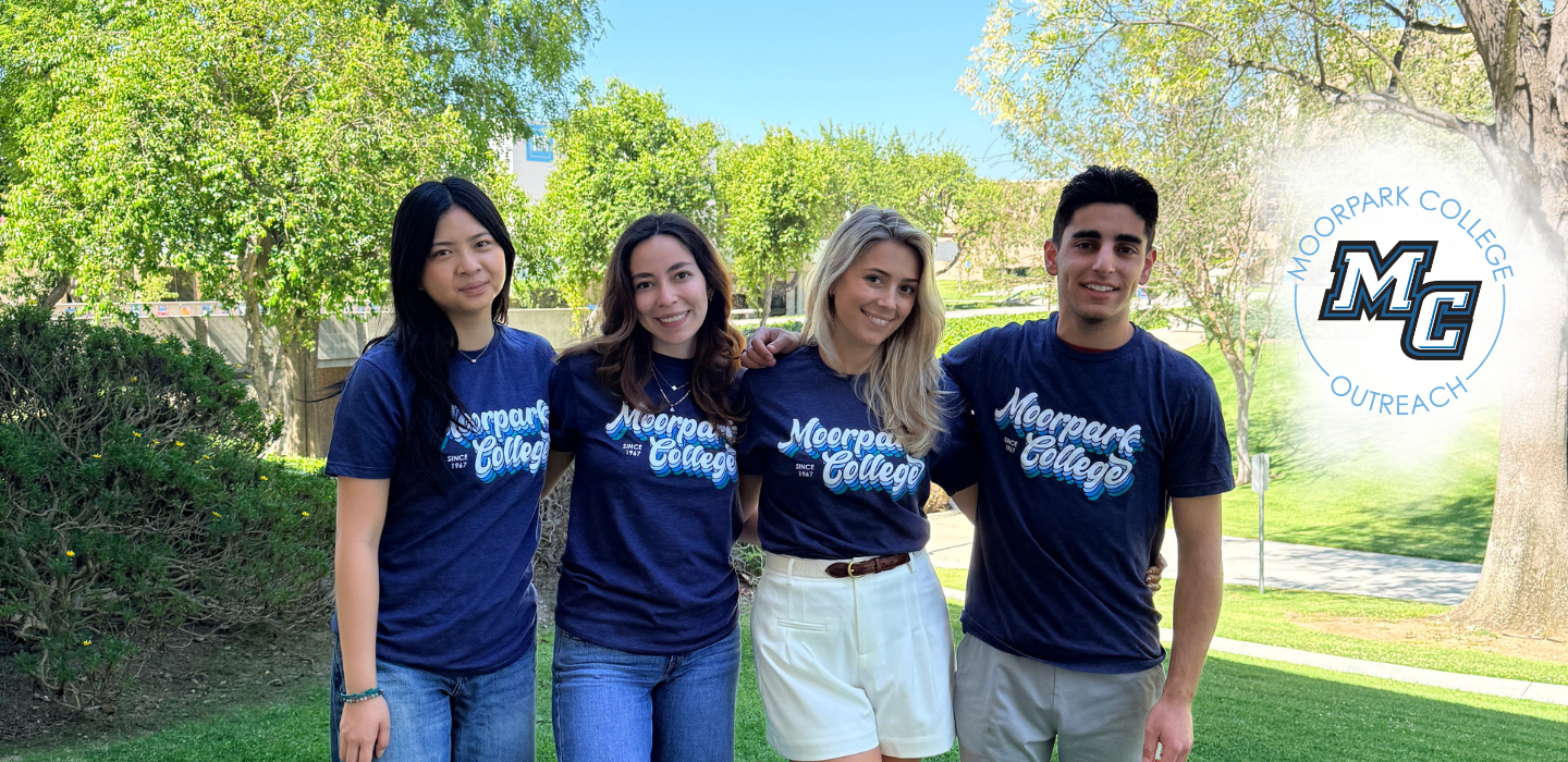 Picture of four Outreach Student Ambassadors posing outside. 