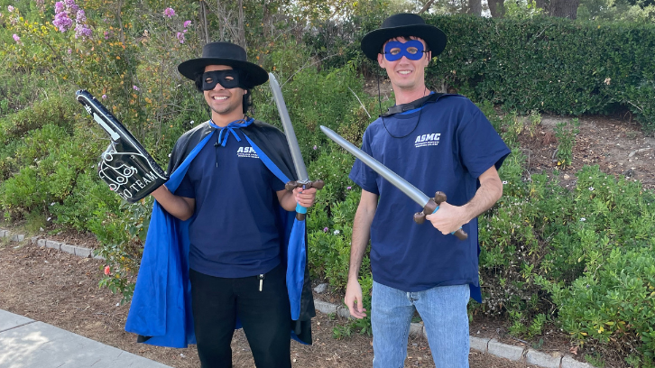 Two students show their Moorpark College pride by dressing like Raiders.